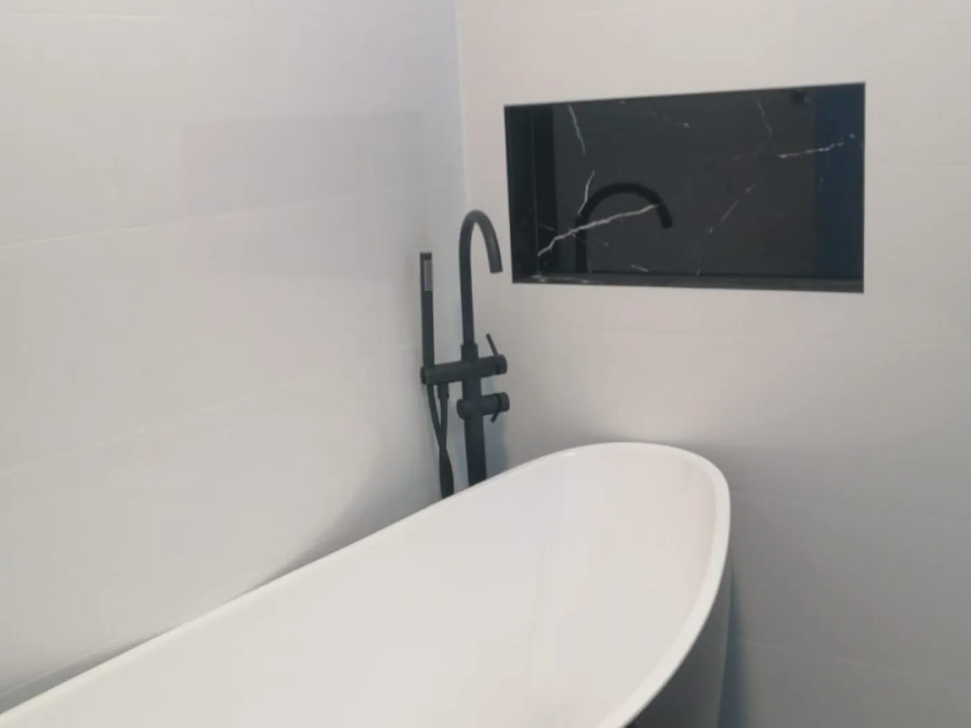 Marsden Park renovation freestanding bath with floor-mounted mixer